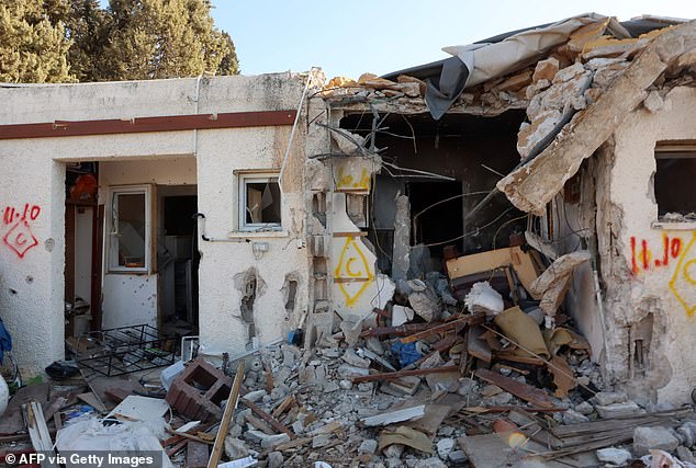 Personal belongings lie among the rubble of a house destroyed during the Oct. 7 attack by Hamas militants on Kibbutz Kfar Aza in southern Israel, near the Gaza Strip, on Oct. 18.