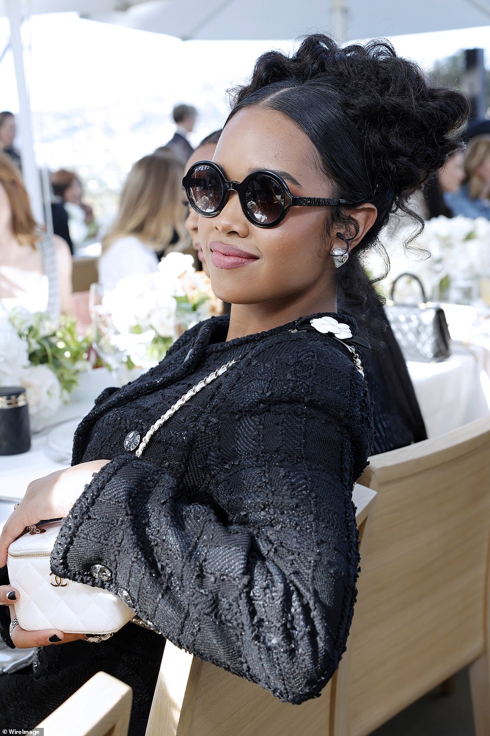 Taking it easy: HER seemed at ease as she showed off her bright white Chanel bag at lunch