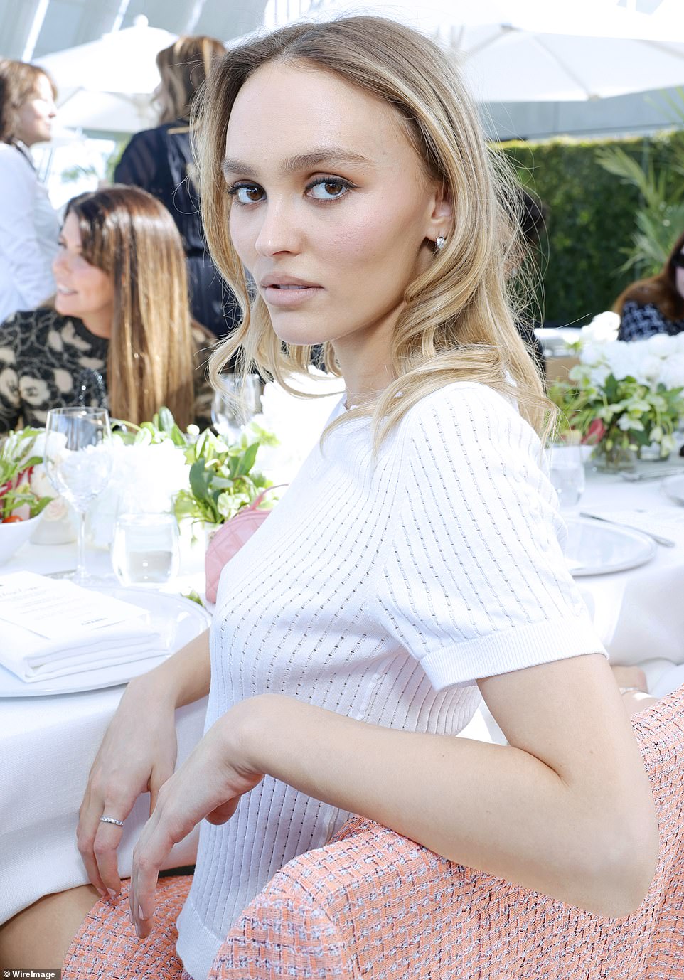 Completing the look: The artist added a bit of brightness to her look with a white blouse at the event