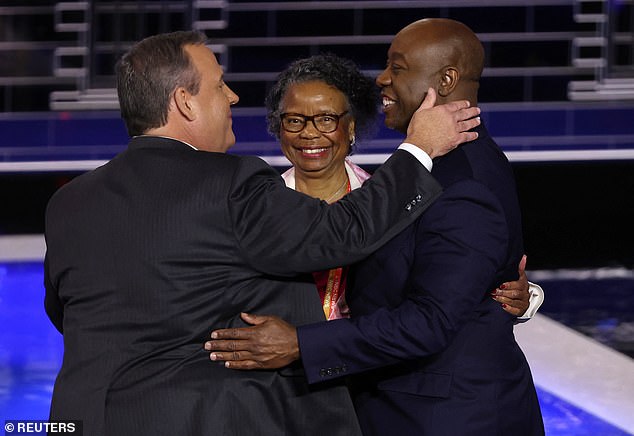 Chris Christie talks to Scott and his mother Frances after the third debate