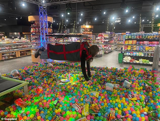 One of the shop's main attractions is a giant human claw for children and adults - where people can immerse themselves in a pool of chocolates and sweet treats to collect as many goodies as they can get their hands on