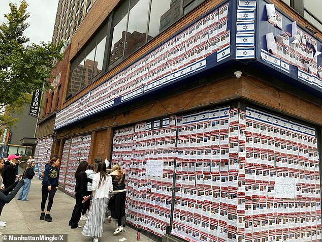 Photos show supporters placing new posters on the grounds of 201 East 23rd Street the next day