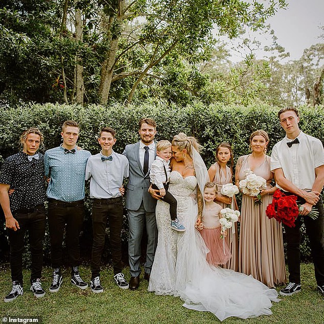 Logan is pictured far left on his mother's wedding day to Gold Coast Titans halfback Kieran Foran