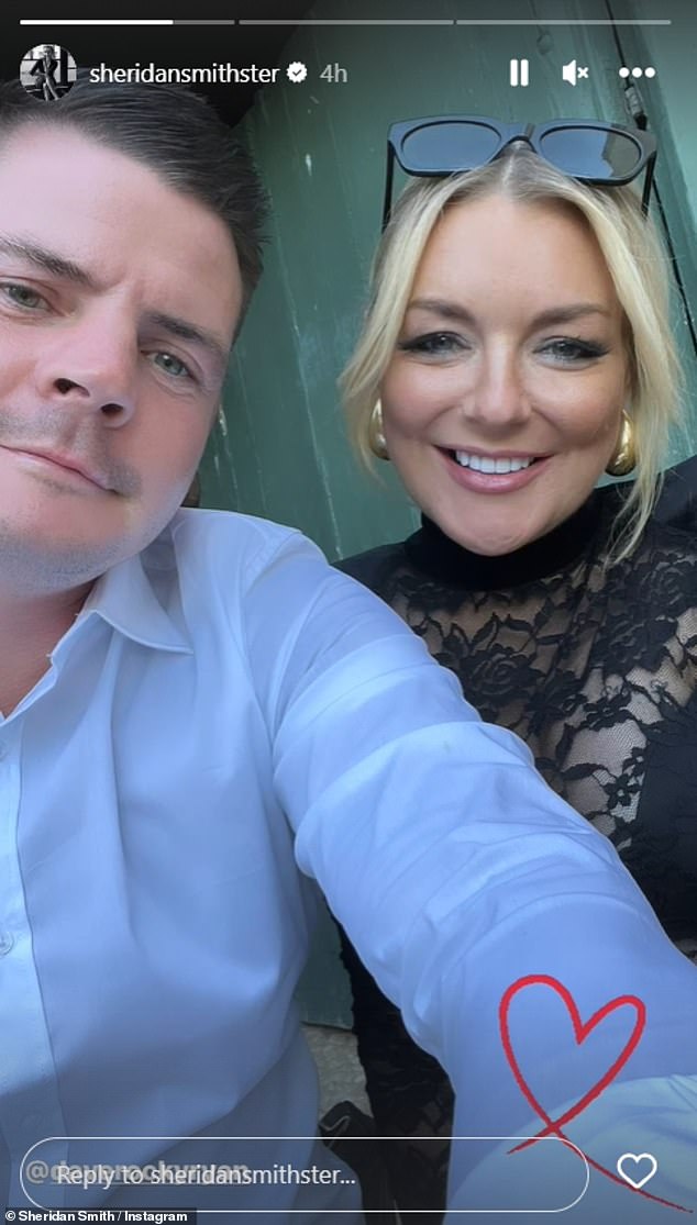 In love: It comes just weeks after Sheridan looked smitten as she posed for several photos with her 'new boyfriend' Dave 'Rocky' Ryan