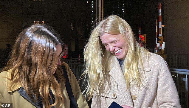 De Niro's former assistant Graham Chase Robinson celebrates outside Manhattan federal court after a jury awarded her $1.2 million in her gender discrimination and retaliation lawsuit