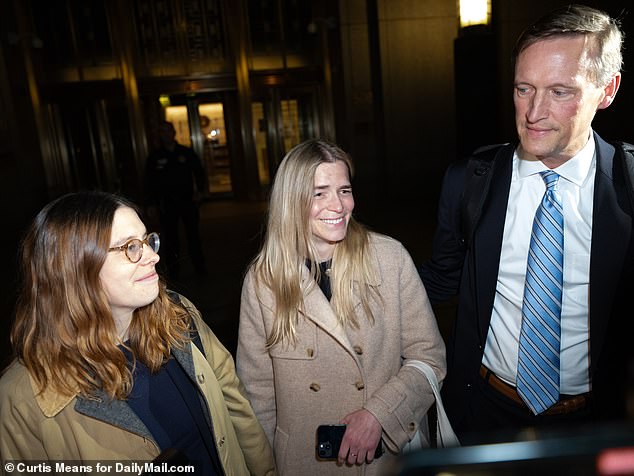 Robinson (center) looked overjoyed as she left the courtroom Thursday.  De Niro was not present