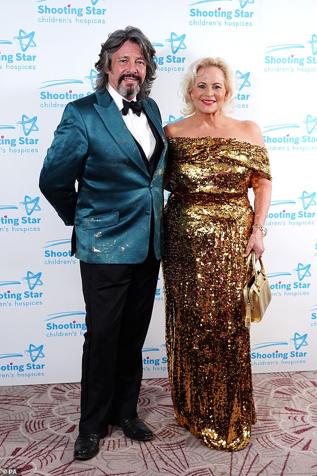 Sweet: Other guests included Laurence Llewelyn-Bowen and his wife Jackie Bowen, who both wore eye-catching outfits for the event