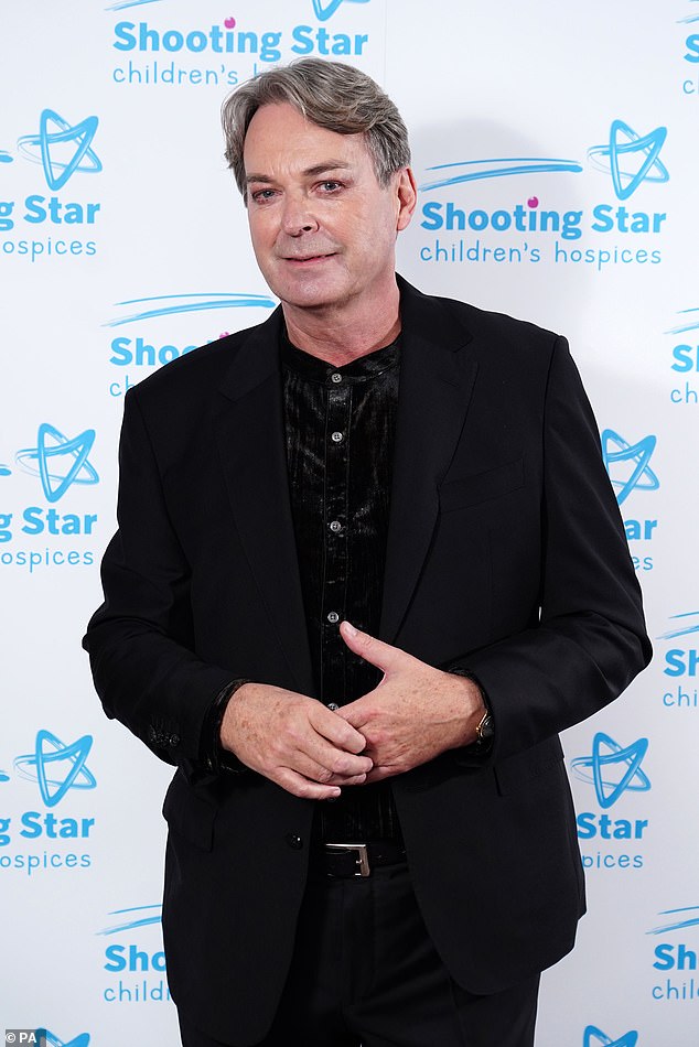 Keep it smart: Comedian Julian Clary looked smart for the event as he donned a black shirt and blazer