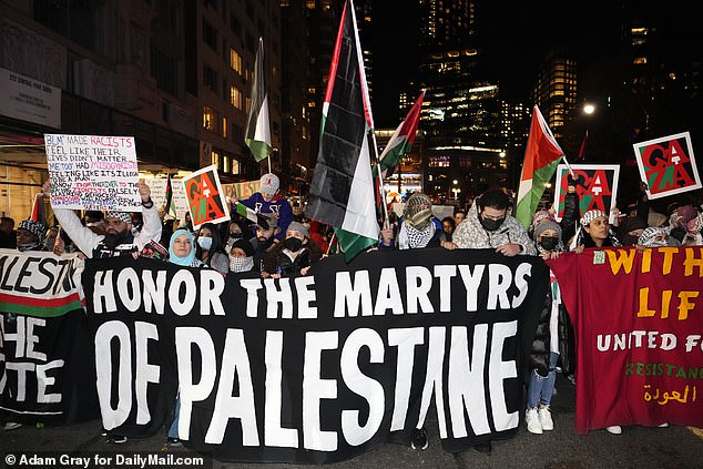 A large crowd descended on Columbus Circle on Friday evening demanding a ceasefire in Gaza