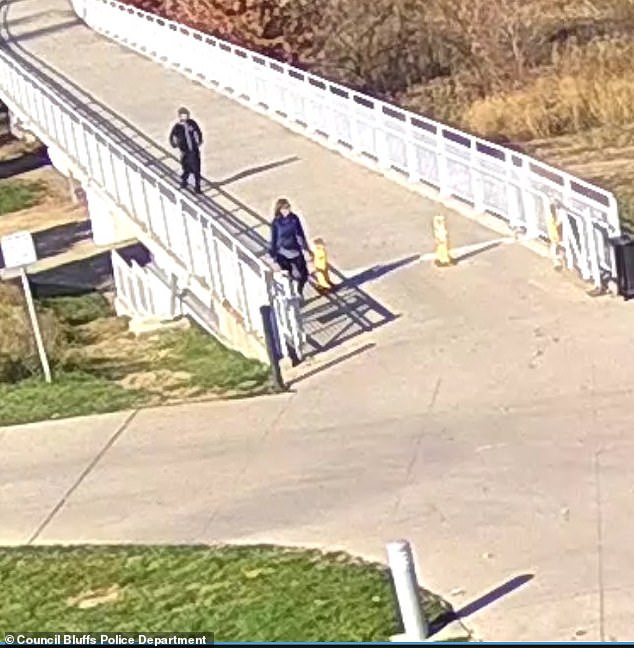 Police officers were called to the scene at 10:53 a.m. and Henton was identified as a suspect from surveillance footage as he allegedly followed the politician on the Bob Kerrey Pedestrian Bride.