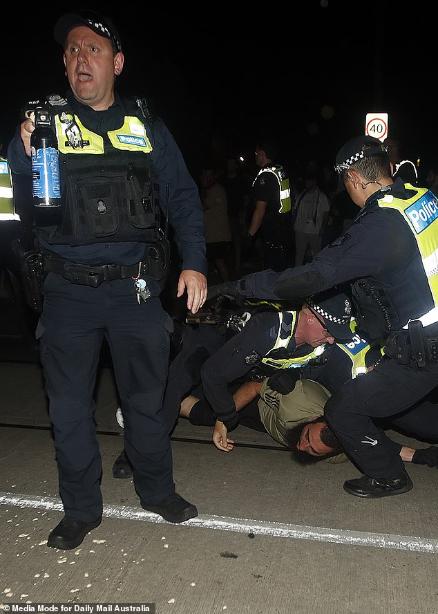 Police officers are seen armed with pepper spray