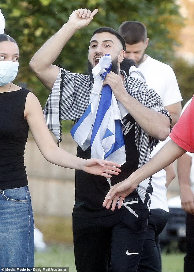 Demonstrators were divided by police on both sides of the street