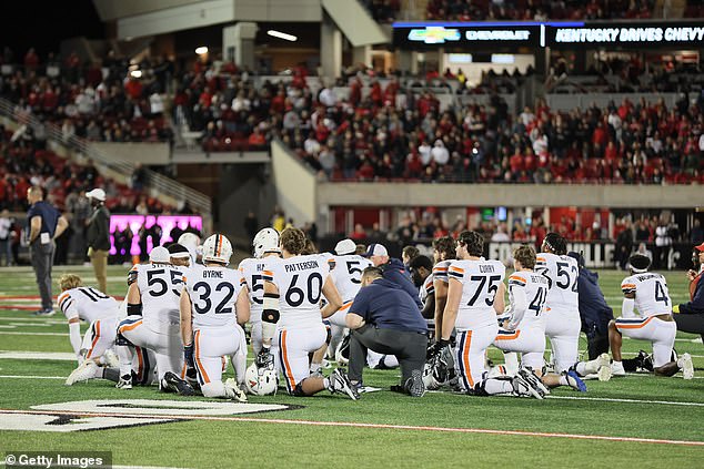 Cavaliers players and staff take a knee after the terrifying incident in Thursday night's game