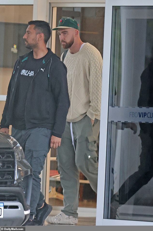 DailyMail.com spotted Kelce shortly after he arrived wearing a beige knit sweater, gray cargo pants and Salehe Bembury Crocs