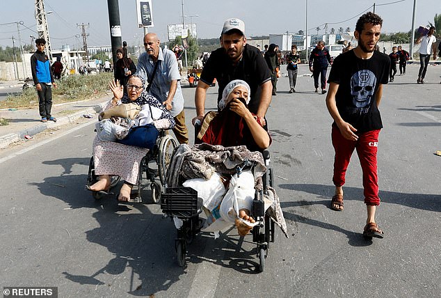 A Palestinian woman injured in an Israeli attack and staying in Al Shifa hospital headed south after fleeing northern Gaza on Friday as the Israeli army moved deeper into the enclave controlled by Hamas.