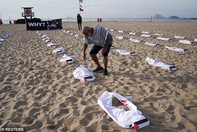 One hundred and twenty shrouds were placed on the beach on November 3 by members of the non-governmental organization Rio da Paz in honor of Palestinian children killed in the ongoing conflict between Israel and Hamas in Gaza.