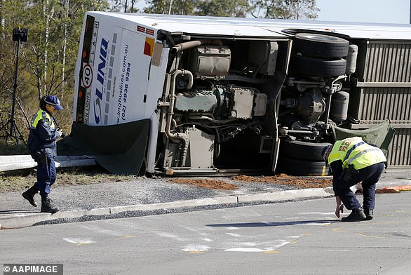 Ten people killed when a bus carrying 35 guests from Mr Gaffney and Madeleine Edsell's wedding crashed near Greta (crash scene pictured)