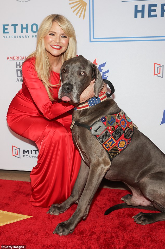 Winning dog: At one point, the longtime supermodel posed with the winning dog, Maverick, a 150-pound European Great Dane therapy dog