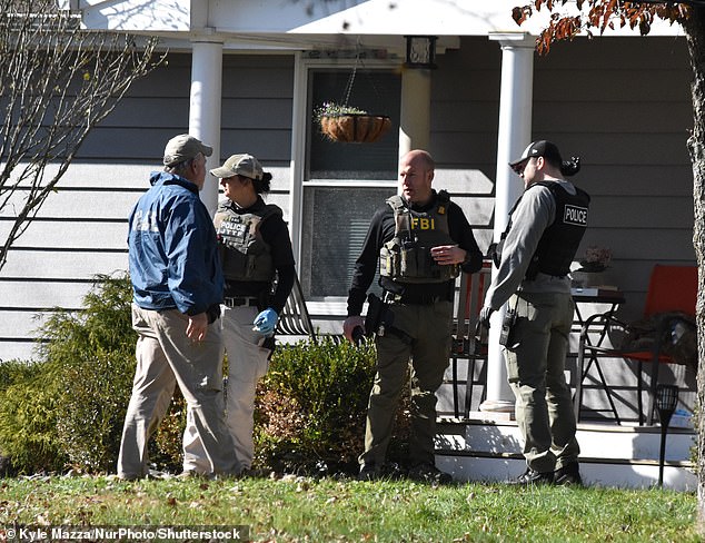 FBI and police tactical teams could be seen in the backyards of homes as they searched for the suspect