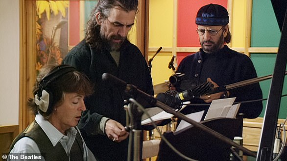 Paul McCartney, George Harrison and Ringo Starr work on a John Lennon demo in the mid-1990s