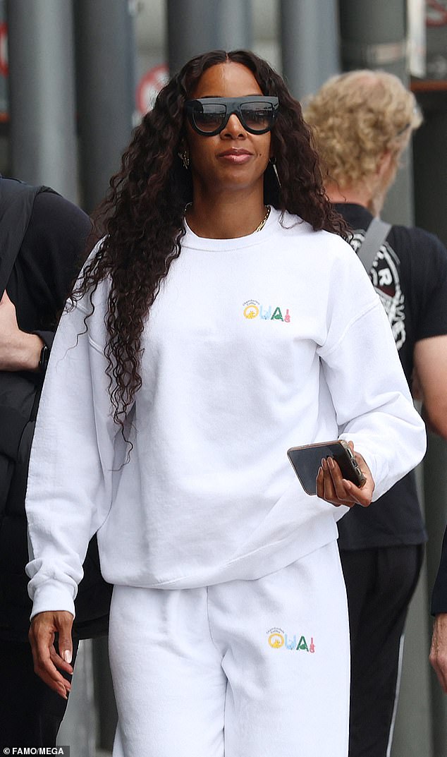 The 42-year-old was dressed comfortably in a white tracksuit from OUAI and accessorized with dark sunglasses