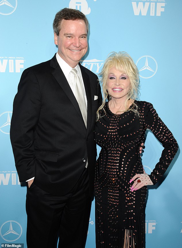 The suspect's father, Sam Haskell Sr., is seen with Dolly Parton, whom he represented for years