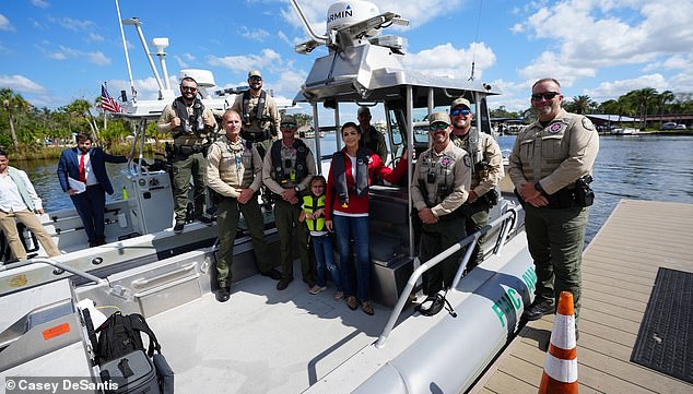 Madison wore a neon yellow life jacket while on the boat