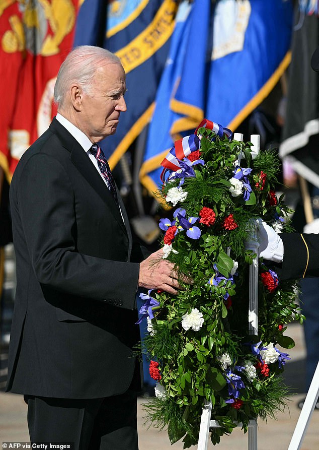 US President Joe Biden lays a wreath at the Tomb of the Unknown Soldier at Arlington National Cemetery during Veterans Day celebrations