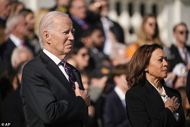 President Joe Biden and Vice President Kamala Harris listen to the national anthem during a wreath-laying ceremony at the Tomb of the Unknown Soldier