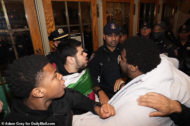 Pro-Palestinian protesters attempt to enter Grand Central but are stopped by police