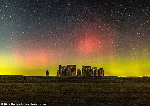 Auroras appear when atoms in Earth's high atmosphere collide with energetic charged particles from the Sun, creating stunning colors of green with a touch of pink, red and violet.  Pictured is Stonehenge illuminated by the northern lights in February this year