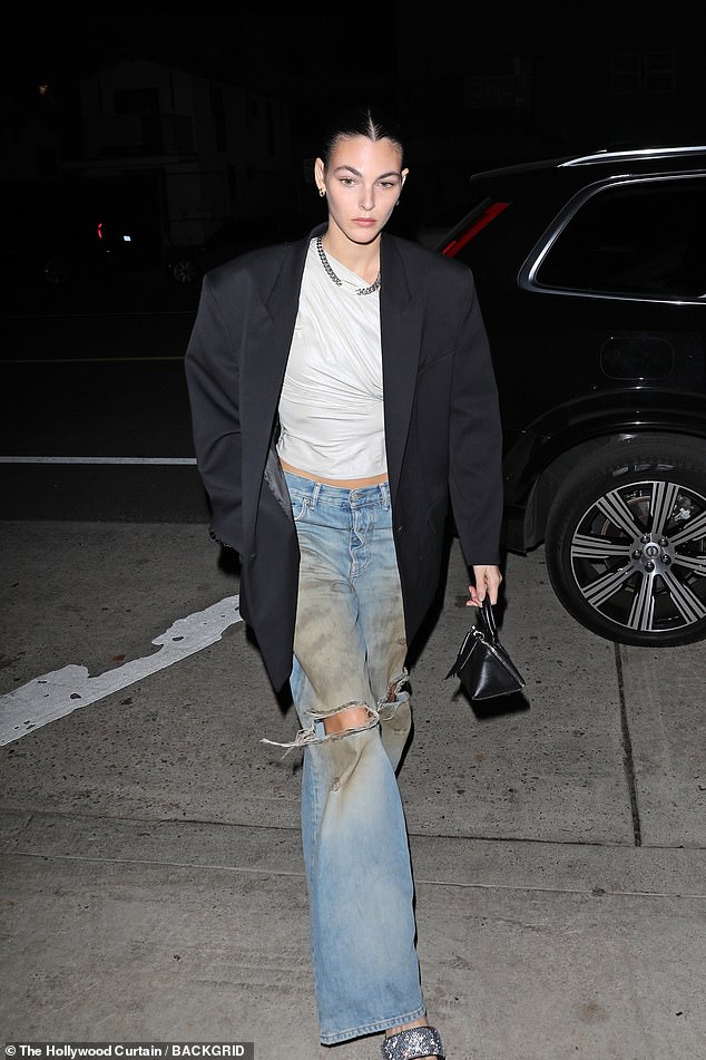 Girlfriend: The Oscar winner was joined by his girlfriend, Vittoria Ceretti, 25, who looked relaxed in loose-fitting distressed jeans, a white one-shoulder ruffled blouse and an oversized black jacket