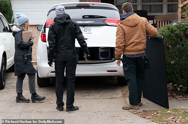 Members of a production crew walked around the family estate and at one point were in the backyard