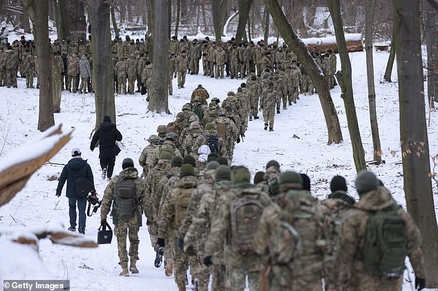 Civilian participants of a Kiev Territorial Defense Unit train in a forest on a Saturday on January 22, 2022 in Kiev, Ukraine