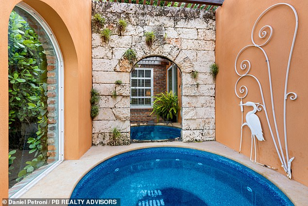 The pool area is equipped with a pool, hot tub (pictured) and on-site doctor