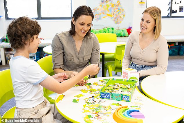 Ellie was all smiles as she posed with young Isabella and took part in some fun activities with the youngster, including completing a jigsaw puzzle