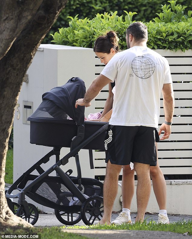 His look was completed with a black baseball cap, white socks and sneakers, and a large silver wristwatch