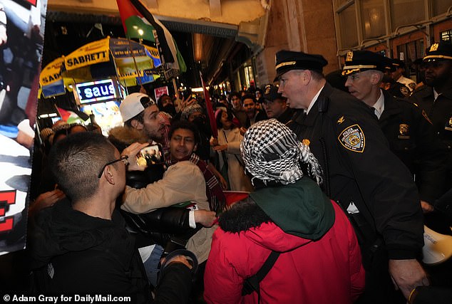 NYPD officers confront some protesters outside Grand Central Station on Friday evening