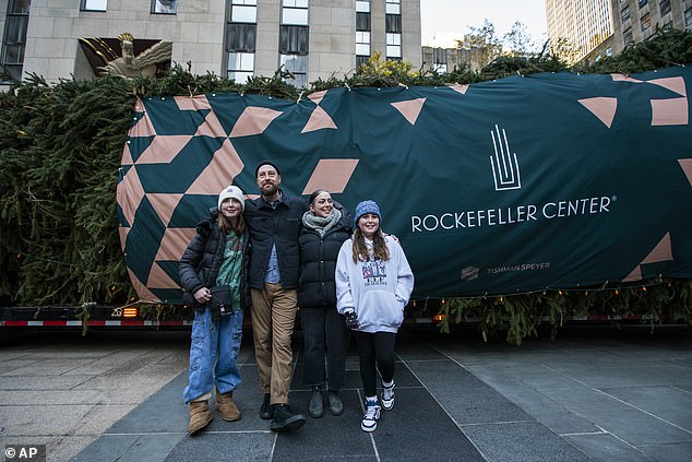 The McGinley family donated the tree.  (They are pictured outside Rockefeller Center on Saturday)