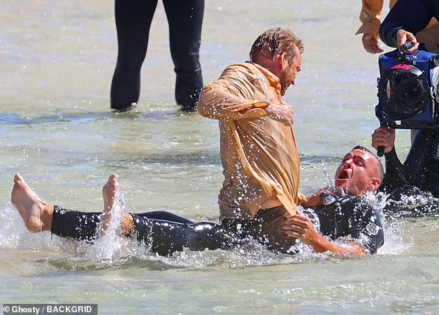 He looked focused as he jumped into the water to wrestle an opponent