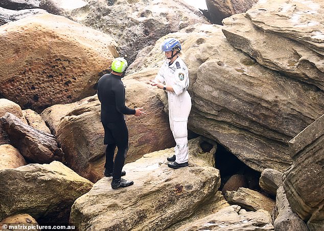 Police on the rocks below the Diamond Bay Reserve on the day Thijssen's battered and bloated body was recovered and later identified at a Sydney mortuary