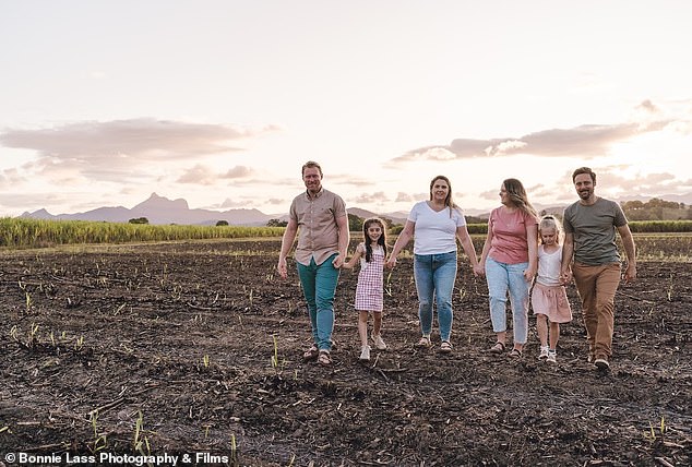 The women pictured here with Katie's husband Luke, left, their daughter Millie, second from left, Amylee's daughter Sophie, second from right and her husband Thiago