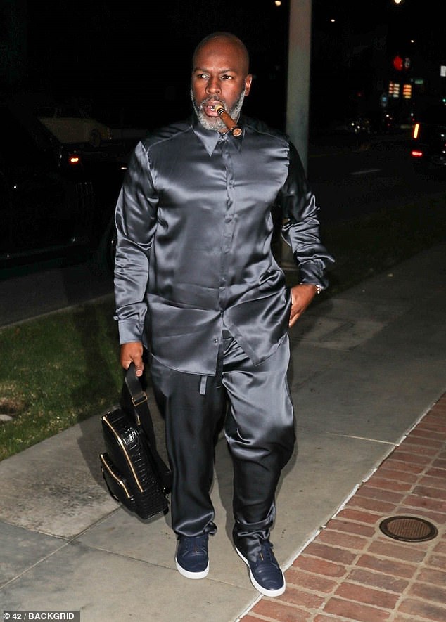 Trendy: Kris Jenner's boyfriend Corey Gamble, 43, made a stylish arrival in his signature silk attire at Leonardo's bash