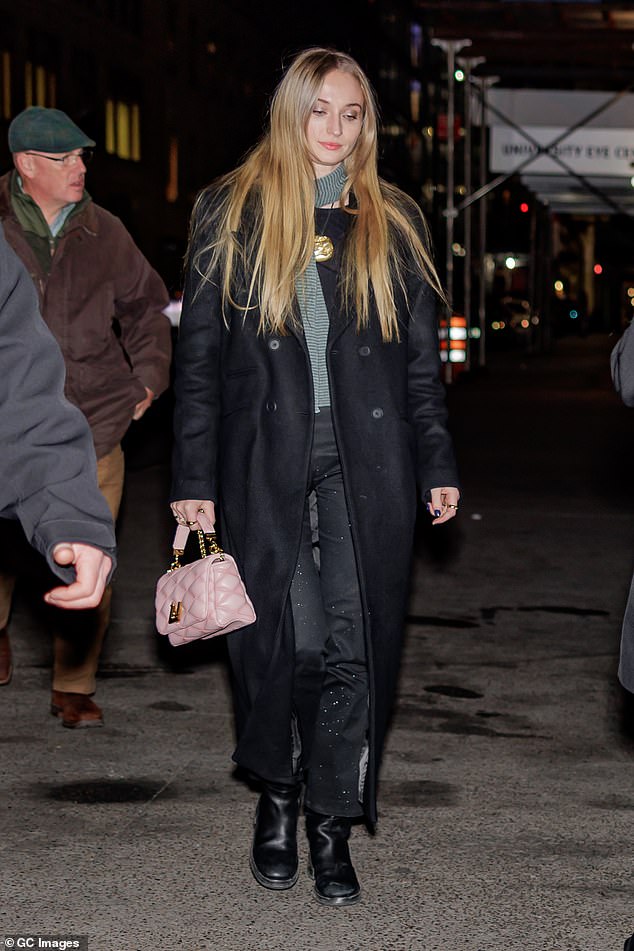 Stunning: Sophie has a casual yet stylish appearance in a green sweatshirt and black jeweled jeans