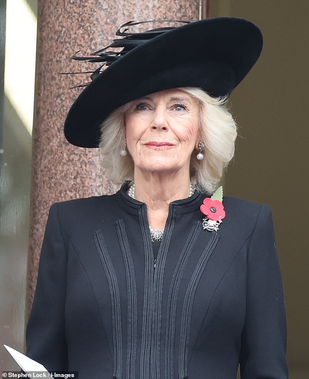 Queen Camilla wore a single red poppy, diamond brooch and pearl earrings at today's ceremony