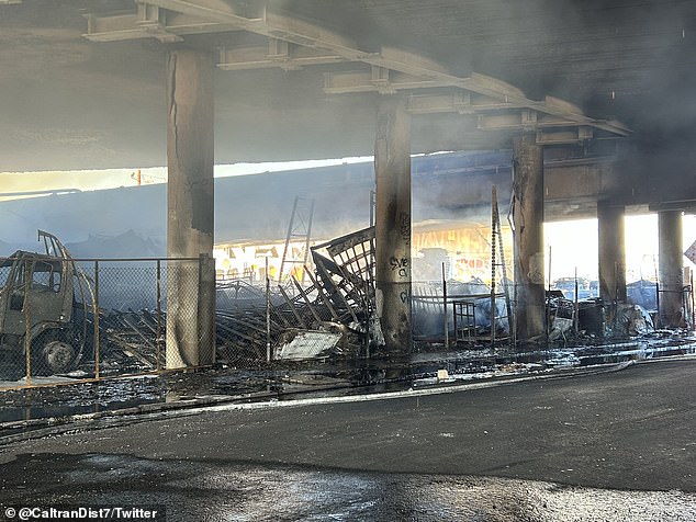 By 2:30 am the pallets had been swallowed up on both sites.  The fire brigade used bulldozers to clear the rubble