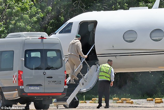 The NFL star climbs the steps of a private plane after a whirlwind few days in Buenos Aires