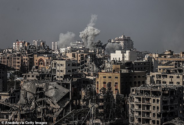 Smoke rises after an Israeli airstrike in the Tel al-Hawa neighborhood where buildings in the southern part of Gaza City were heavily damaged or collapsed on November 9, 2023