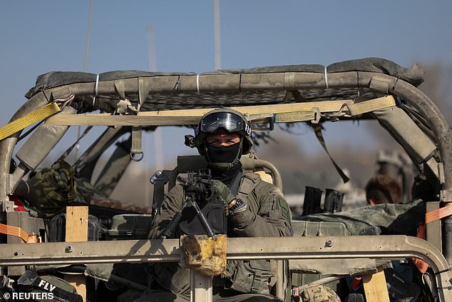 An Israeli soldier operates amid the ongoing ground invasion in the Gaza Strip against the Palestinian Islamist group Hamas, on Israel's border with Gaza in southern Israel, November 8