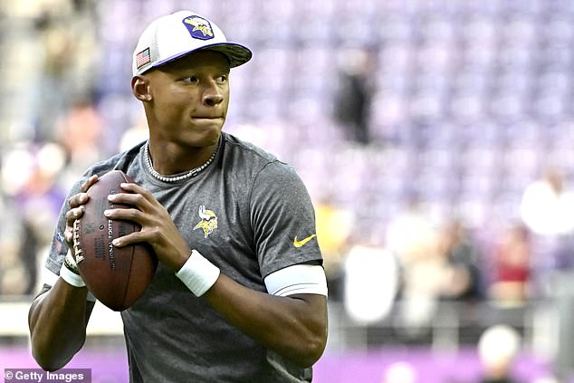 Dobbs warms up before the game against the New Orleans Saints at US Bank Stadium